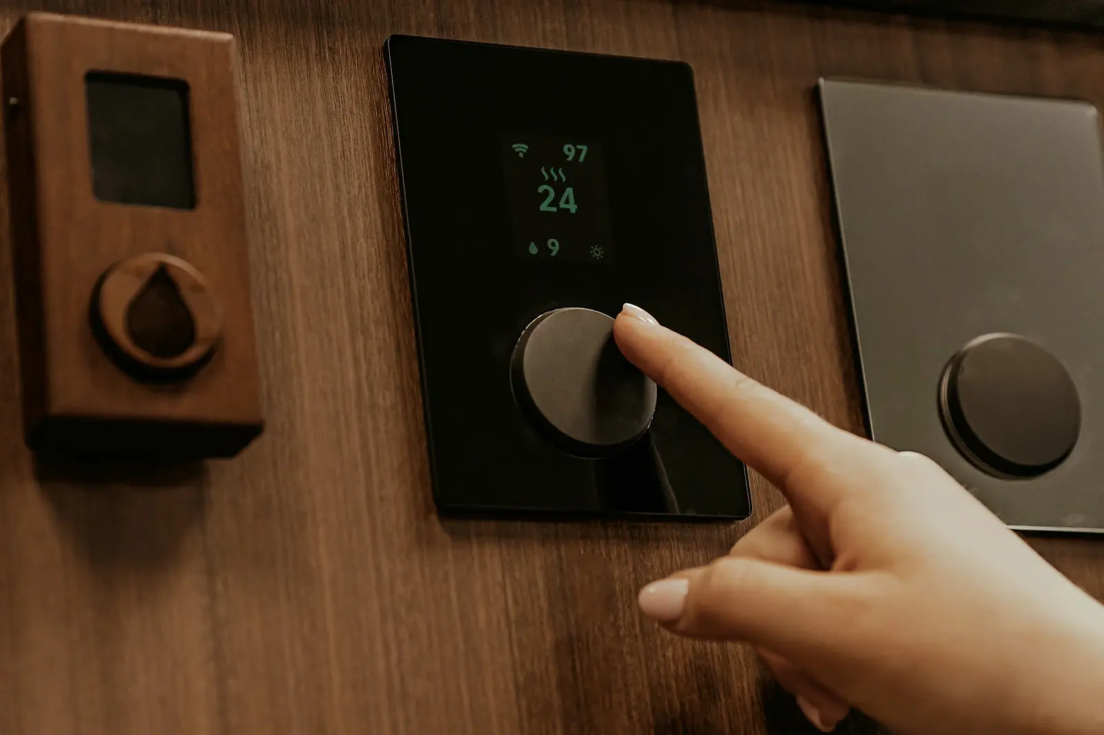 Adjusting a home thermostat during an HVAC problem in Yuba City