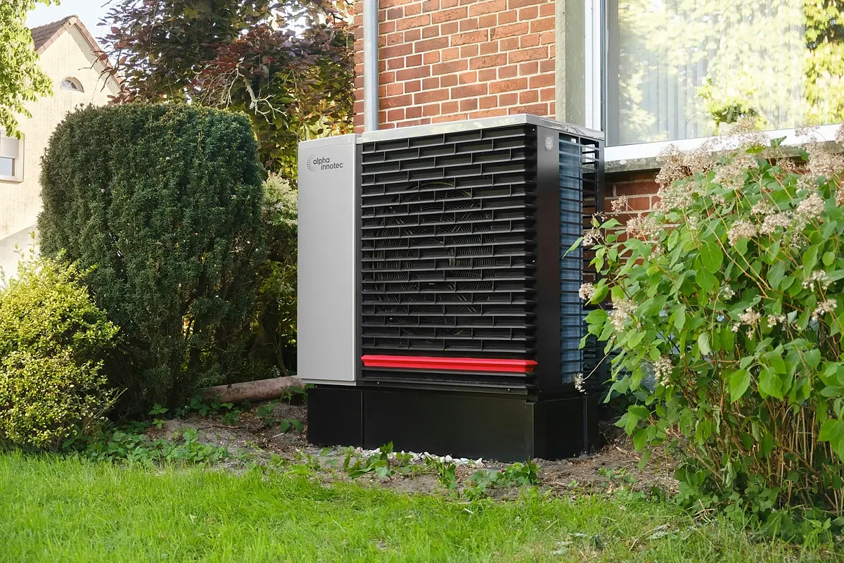 An AC condenser in a home's side yard